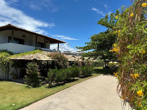 a view of the house from the driveway at Vila Sol Chalés in Pôrto de Pedras