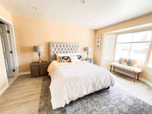 a bedroom with a large bed and a window at Luxury Oasis in Central Encino w Pool & Spa Topeka in Los Angeles