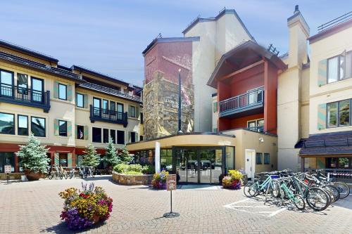 a group of buildings with bikes parked in a courtyard at Lion Square Lodge Tower T401 in Vail