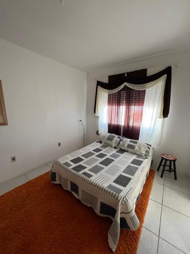 Ένα ή περισσότερα κρεβάτια σε δωμάτιο στο Loft na Rua Gonçalves Chaves