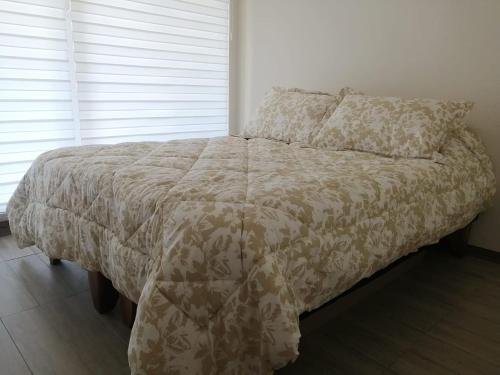 Ένα ή περισσότερα κρεβάτια σε δωμάτιο στο Alta Vista Pucon Centro