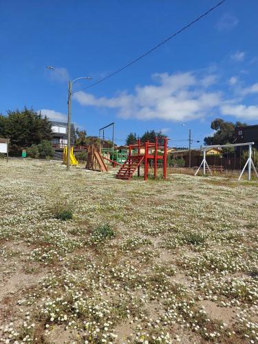 an empty park with a playground in a field at Casa cerro Tacna Maitencillo in Maitencillo