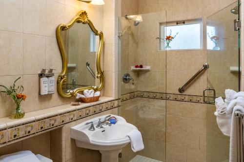 a bathroom with a sink and a shower at The Eagle Inn in Santa Barbara
