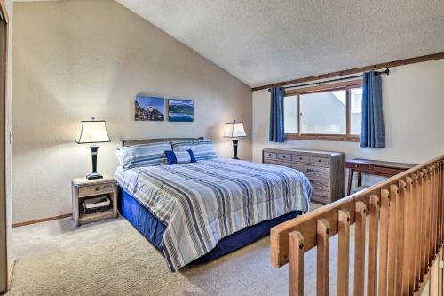 a bedroom with a bed and a window and a staircase at Mountainside Royalview Condo: Pool/Hot Tubs, Great Location in Frisco