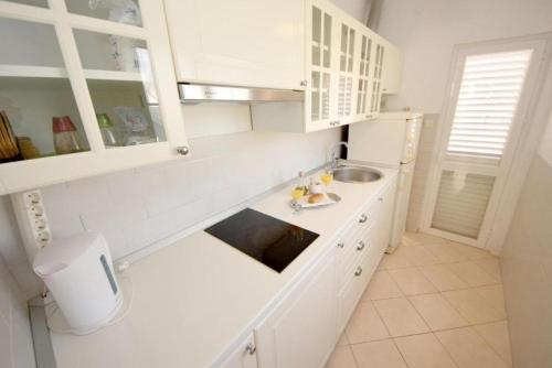 Kuchyňa alebo kuchynka v ubytovaní Apartments Lucky