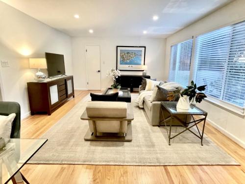 a living room with a couch and a table at Nicely Furnished 2BR Menlo Park Apartment in Menlo Park