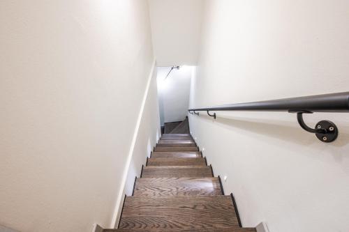 a stairway with a hand rail and a stair case at Casa del Cinema in Modena