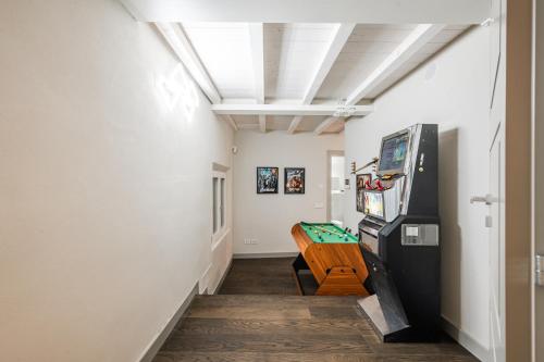 a hallway with a couch and a table in a room at Casa del Cinema in Modena