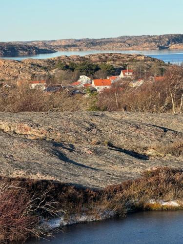 a view of a field with a body of water at Skönaste stället som finns. Bara 300 m till havet. in Lysekil