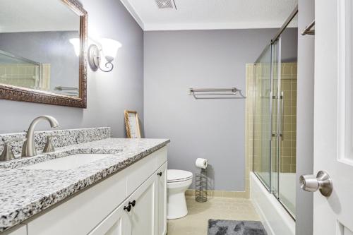 a bathroom with a sink and a shower at Walk to Parks and Town Square Cary Home with Yard! in Cary