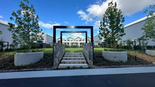 a set of stairs in front of a building at Brand-new entire terrace home in Wacol