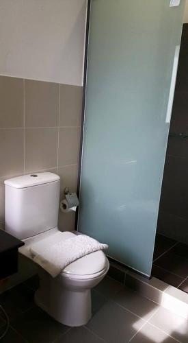 a bathroom with a white toilet in a stall at Teddy Bear Villa Hua Hin in Hua Hin