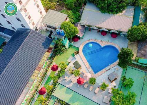 an overhead view of a swimming pool with a heart at Minh Chau Beach Resort in Quang Ninh