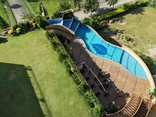 a train on a roller coaster in a park at Summit Ridge Tagaytay - Newly Renovated in Tagaytay