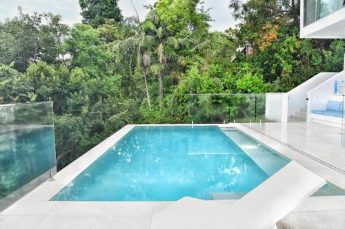 a swimming pool in the middle of a house at RiverView GetAway in Maroochy River