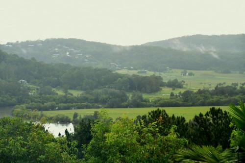 a view of a valley with a river and trees at RiverView GetAway in Maroochy River
