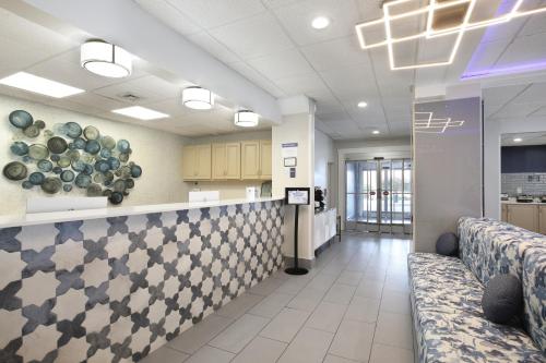 a lobby of a hospital with couches and a counter at Best Western Mystic Hotel in Mystic