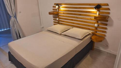 Postel nebo postele na pokoji v ubytování Studio 50m de la mer Village du Diamant