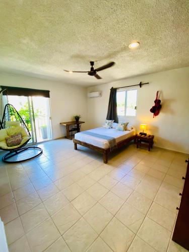 Ένα ή περισσότερα κρεβάτια σε δωμάτιο στο Aguacatl Cozumel