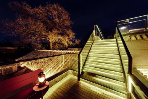 a set of stairs with a light on top of it at Guipu Beihai Courtyard Hotel Beijing in Beijing