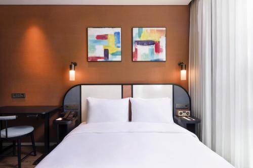 Letto o letti in una camera di Mercure Ambassador Seoul Magok