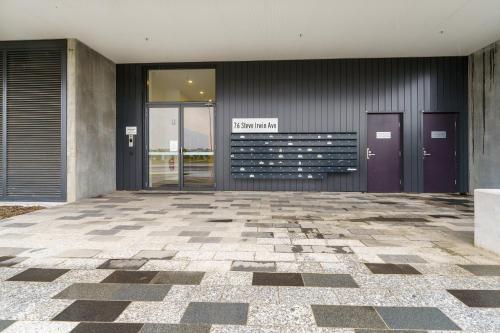 a lobby with purple doors and a tiled floor at Inviting Family-Friendly Sanctuary in Wright - Hosted by Canstay in Weston Creek