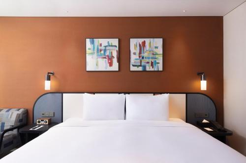Letto o letti in una camera di Mercure Ambassador Seoul Magok