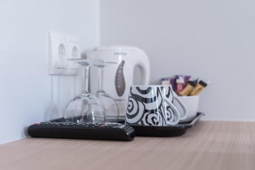 a computer keyboard and a coffee mug on a counter at Hotel Isafjördur - Torg in Ísafjörður