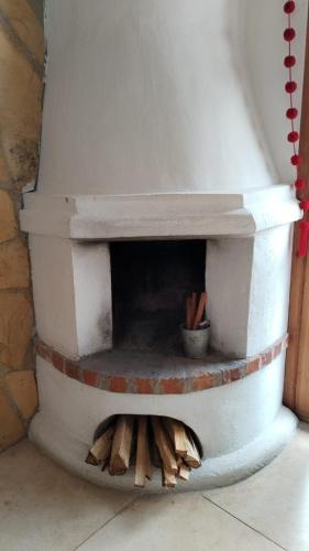 a brick oven with a pile of wood in it at Gaia Guest House in San Cristóbal de Las Casas