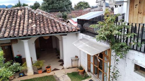 an overhead view of a white house with a roof at Gaia Guest House in San Cristóbal de Las Casas