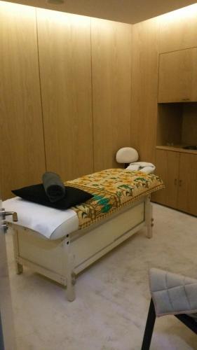 a room with a bed with a hat on it at Napa Mermaid Hotel & Suites in Ayia Napa