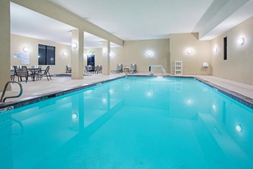 a pool with blue water in a hotel room at Holiday Inn Express & Suites Truth Or Consequences by IHG in Truth or Consequences