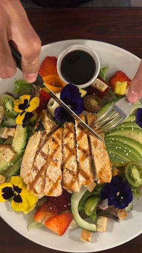 a plate of food on a table with a plate of food at Grandpas Hotel & Restaurante in Cartago