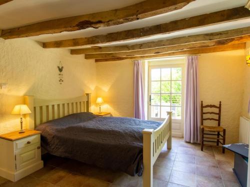 a bedroom with a large bed and a window at Maison de charme avec jardin clos et Wifi au cœur du Périgord Noir - FR-1-616-401 in Saint-Pompont
