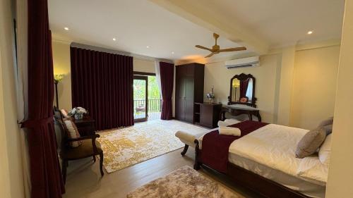 Postel nebo postele na pokoji v ubytování Tamarind Villa in langkawi