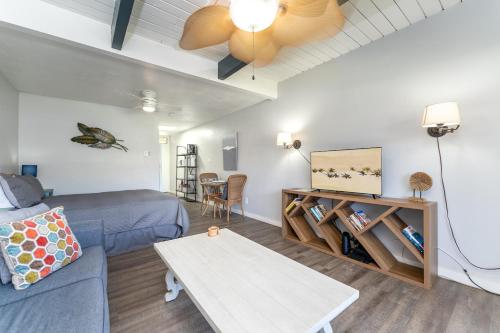 a living room with a couch and a table at Cute Studio across the Beach, pool, hot tub, wifi LSV04 in Kihei