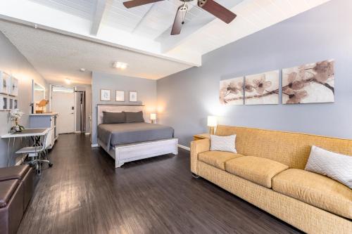a living room with a couch and a bed at Beautiful Kihei Hideaway Studio Across the Beach LSV02 in Kihei