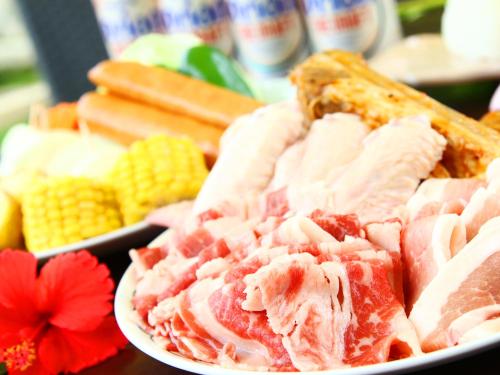 a plate of ham and corn on a table at Beach and Mountain in Ishigaki Island