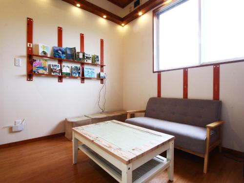 a living room with a couch and a table at Beach and Mountain in Ishigaki Island