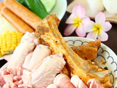 a plate of food with ham and corn on a table at Beach and Mountain in Ishigaki Island
