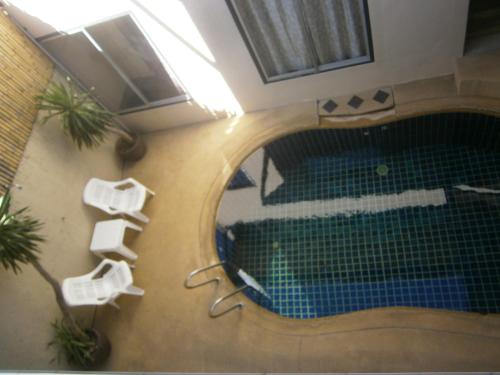 a view of a swimming pool in a building at Infinity Boutique Hotel Kata Beach in Ban Kata