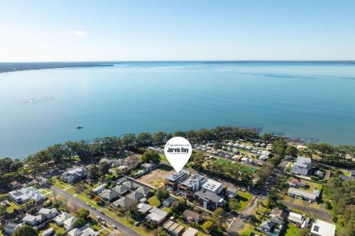 an aerial view of a city with a hot air balloon at Ocean Bliss by Experience Jervis Bay in Huskisson
