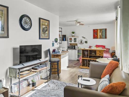 a living room with a couch and a table at Quaint Monument Retreat studio in Grand Junction
