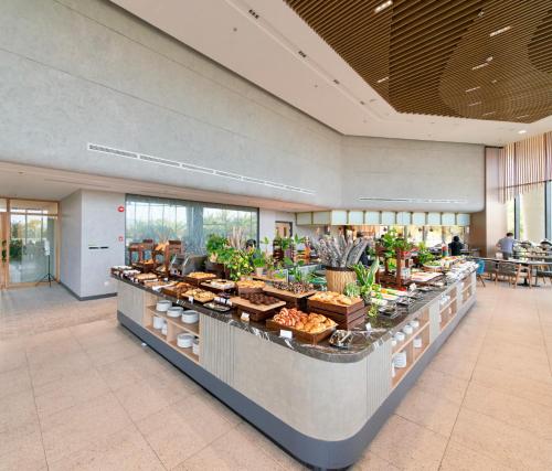 a buffet line with food on it in a building at Hese Pool Villas & Resort Cam Ranh in Cam Ranh