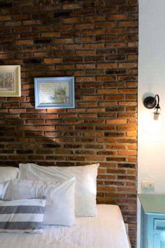 Katil atau katil-katil dalam bilik di Nai Suan Bed and Breakfast