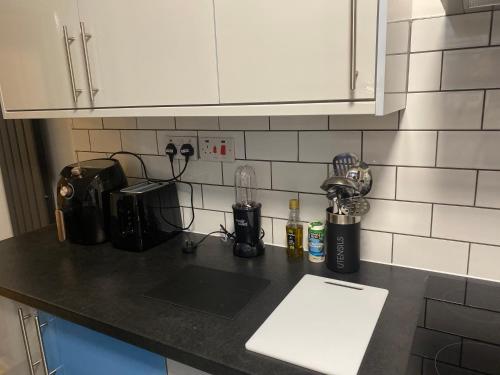 a kitchen counter top with a blender and appliances on it at Harcourt Road in Nottingham