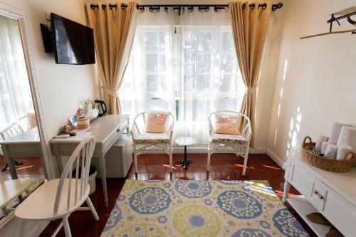 Televisyen dan/atau pusat hiburan di Nai Suan Bed and Breakfast