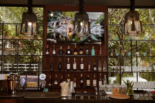 a bar with a bunch of bottles of wine at Thao Dien Village Boutique Hotel in Ho Chi Minh City