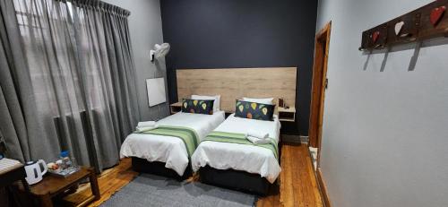 Ένα ή περισσότερα κρεβάτια σε δωμάτιο στο Bo Kamer Guesthouse