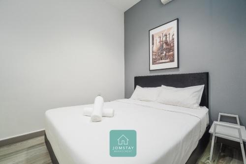 Postel nebo postele na pokoji v ubytování JOMSTAY Octagon Ipoh Suites
